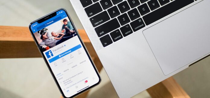 iPhone X beside MacBook