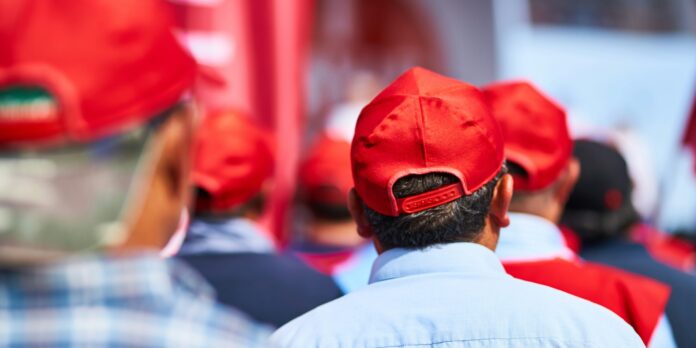 man in red knit cap and white shirt