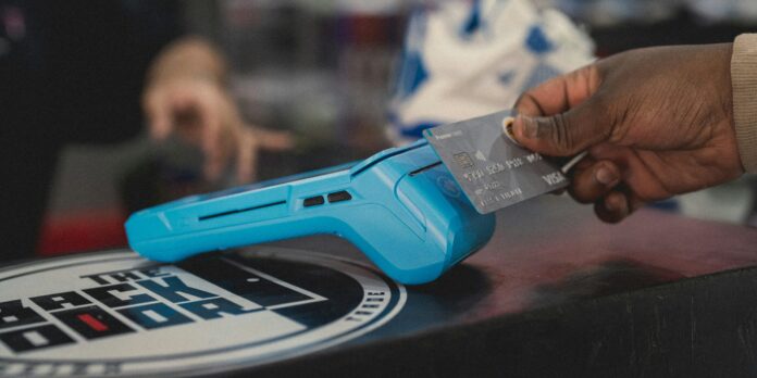 a person holding a blue object in their hand