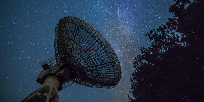 white satellite dish under blue sky during night time