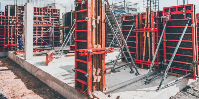 red metal structure with beam